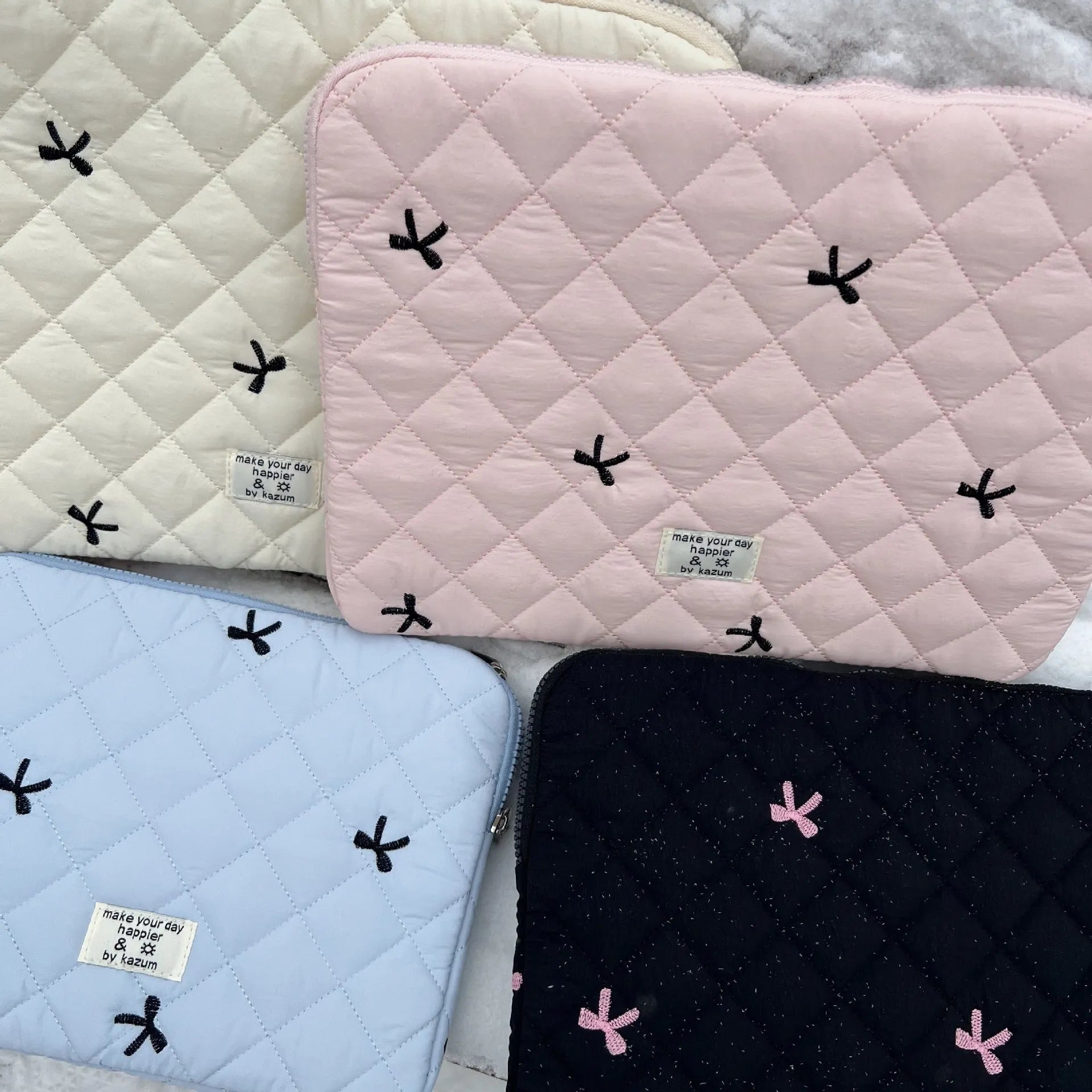 Rhombus embroidered bow notebook storage bag in nylon with device-specific sizing options