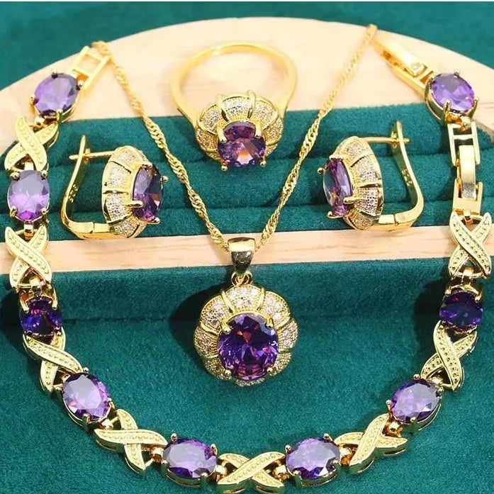 18k gold plated jewellery set with cubic zirconia stones showing necklace, earrings, ring, and bracelet