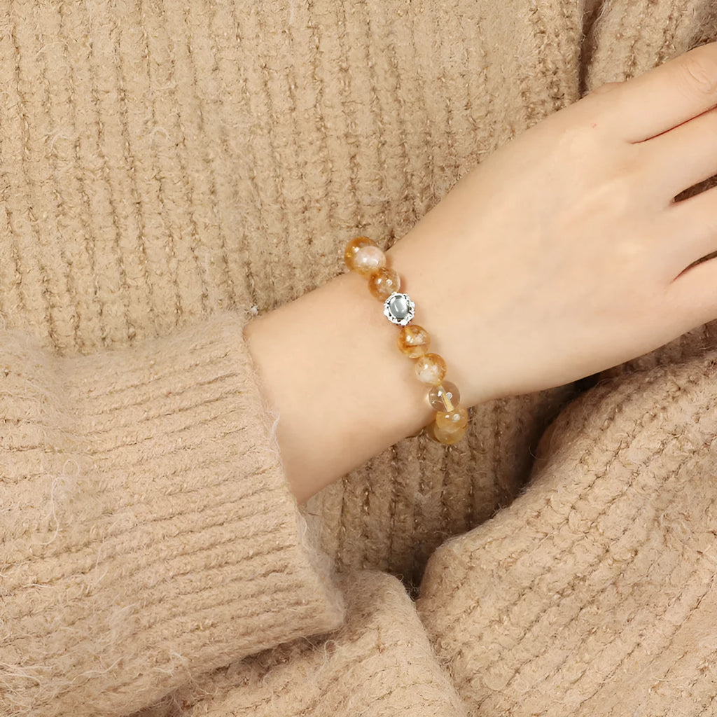 10mm geometric-cut citrine bracelet with hand-ground surface texture on wrist