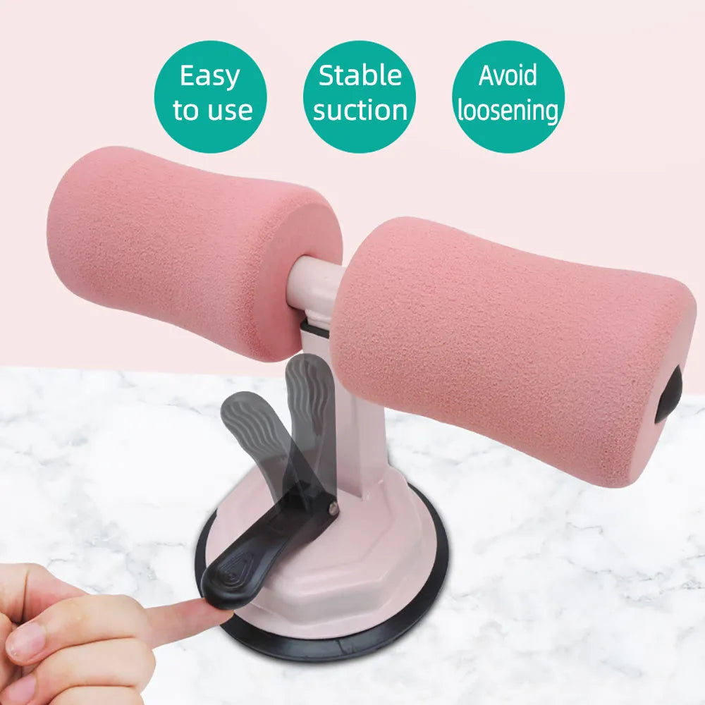 Pink adjustable sit-up bar floor assistant, 27x21cm, with foam padding and suction base