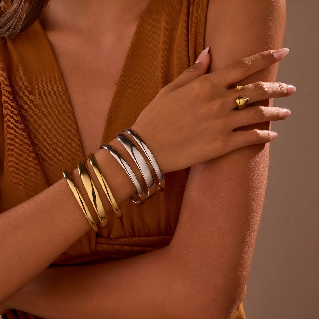 Women's geometric stainless steel bracelet with simple opening clasp in gold tone finish