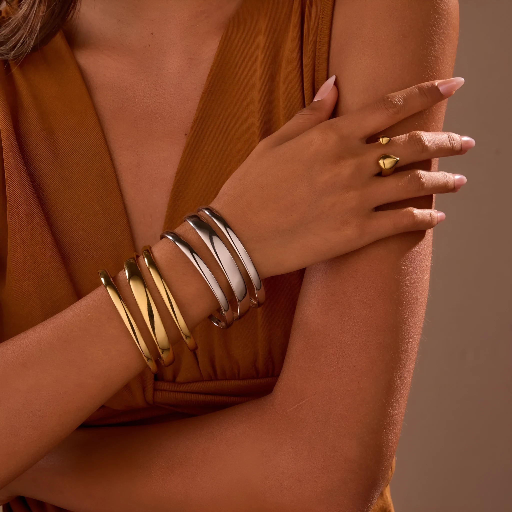 Women's geometric stainless steel bracelet with simple opening clasp in gold tone finish