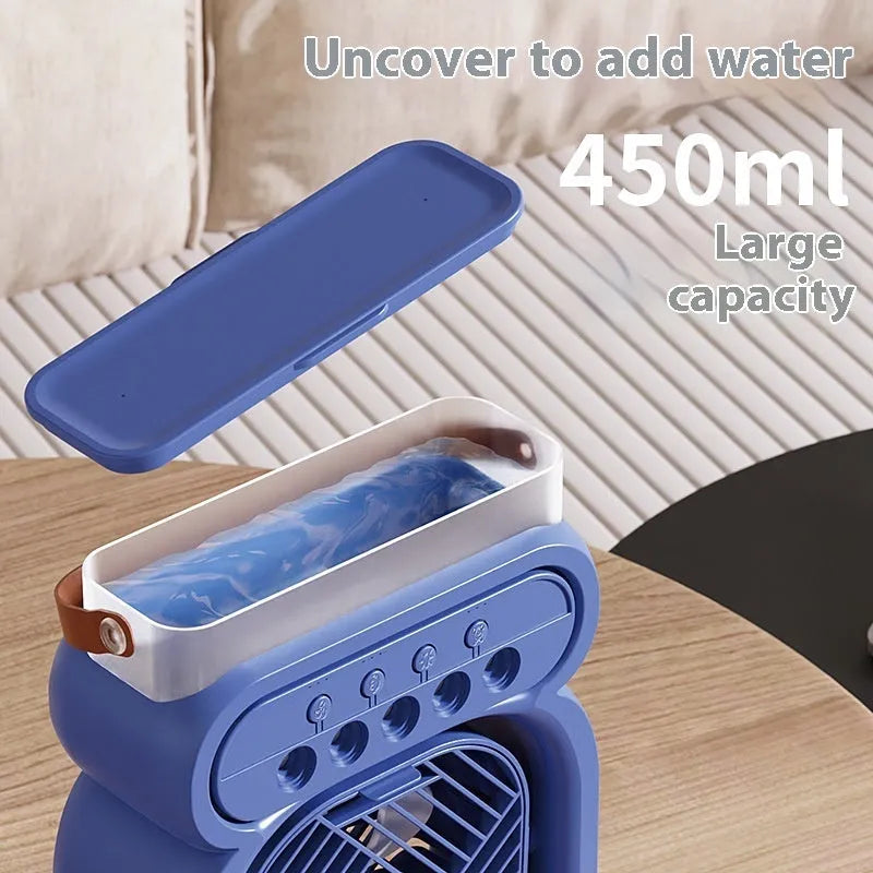 Black portable air cooler with LED lights, water tank, and USB cable on wooden desk