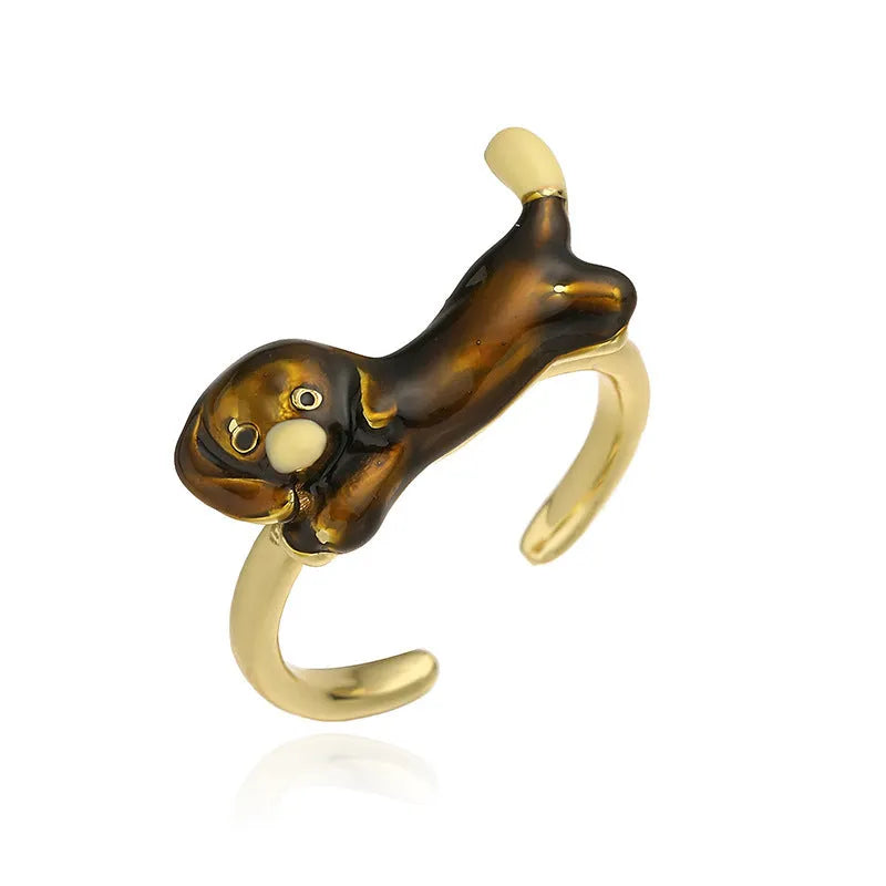 Copper open mouth ring with colourful drip oil finish and sausage dog animal motif