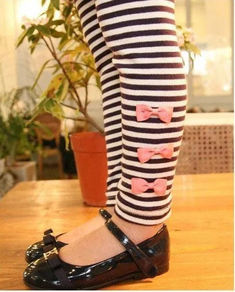 Pink cotton two-piece clothing set for a girl, showing the matching top and bottom.