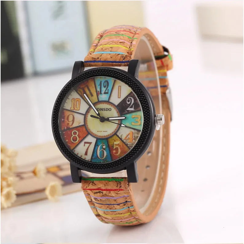 Vintage leather women's quartz watch showing 37mm round dial with tempered glass and stainless steel buckle