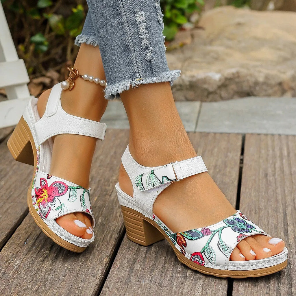 White women's high heel sandals with an adjustable Velcro strap buckle.