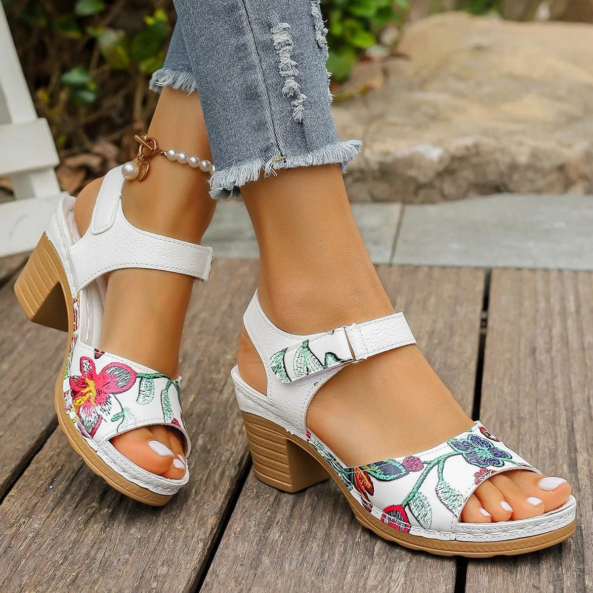 White women's high heel sandals with an adjustable Velcro strap buckle.