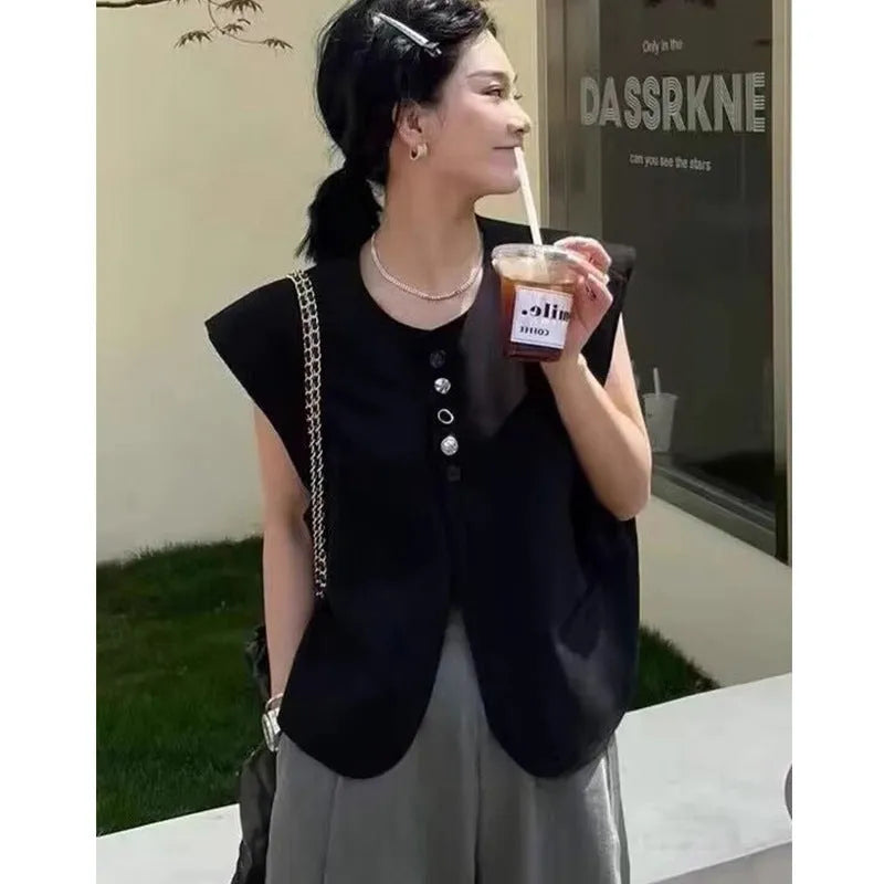 Women's loose-fit polyester vest in solid colour with a pocket, shown in milky white.