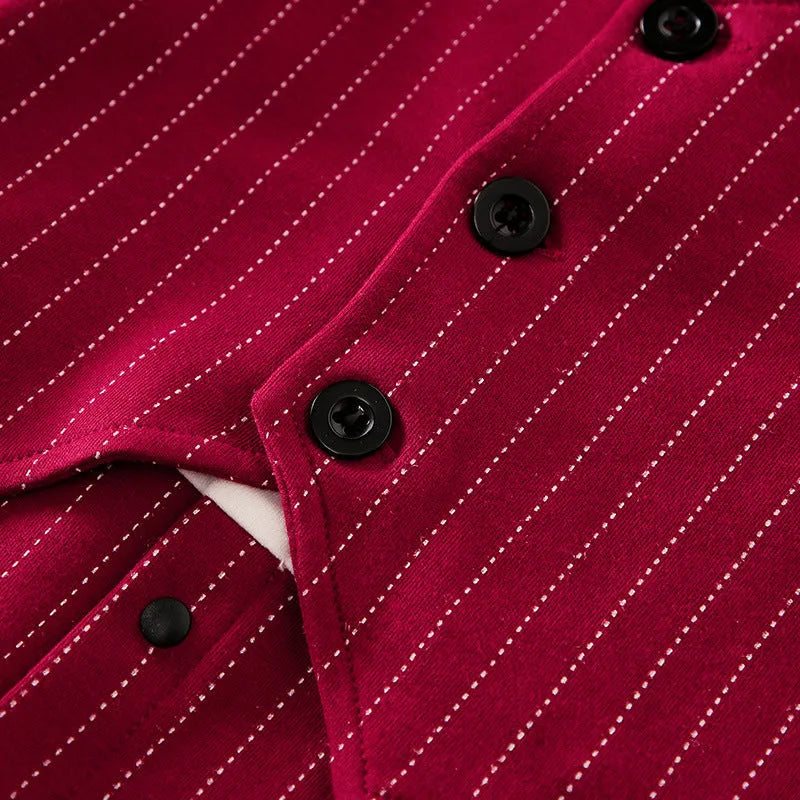 Baby boy wearing a wine red cotton gentleman-style long sleeve jumpsuit with single-breasted closure.