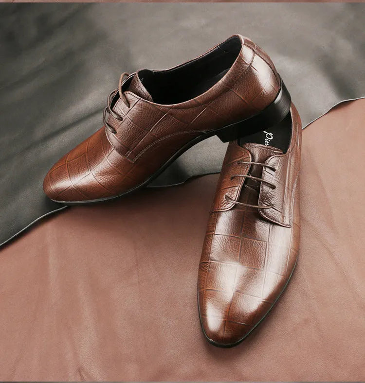 Men's black checkered leather derby shoes with a pointed toe and rubber sole.