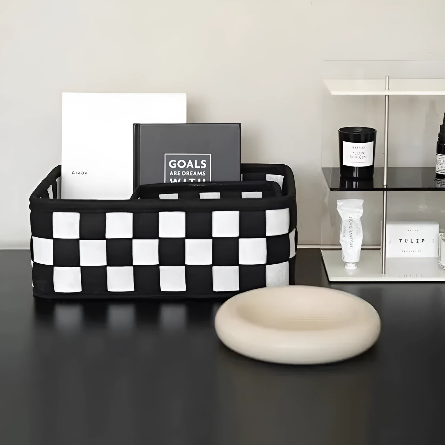 Checkerboard patterned grey felt folding storage basket with dimensions 37cm by 29cm.