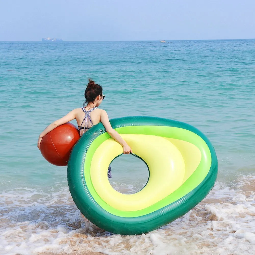 Giant green avocado-shaped inflatable pool float measuring 169cm by 130cm.