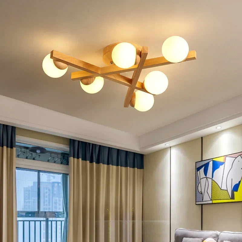 Nordic-style wooden effect ceiling light with three adjustable neutral white LED heads on angled arms.