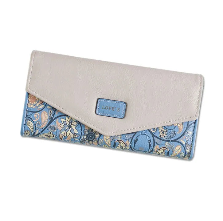 Women's black PU leather three-fold wallet with a metal clip closure, shown open.