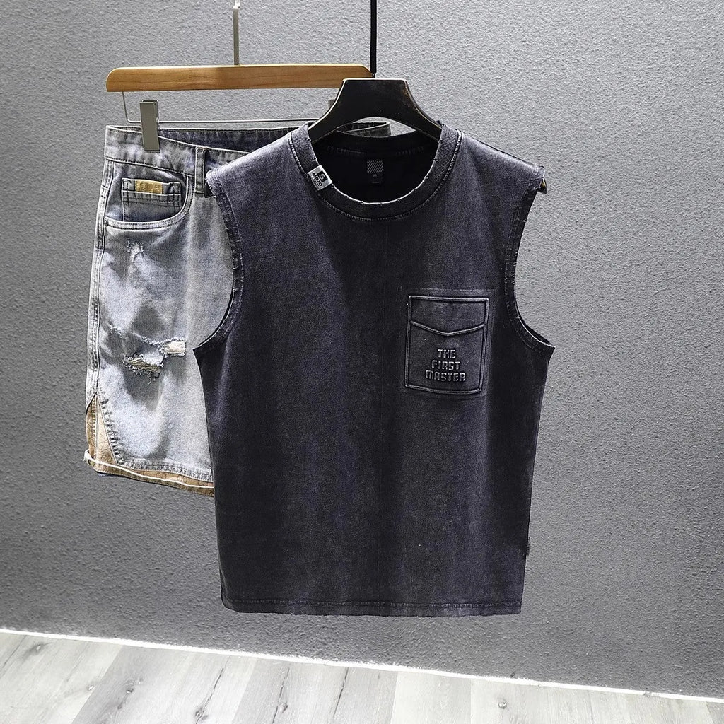 Women's solid black cotton sleeveless t-shirt with a loose fit and straight hem.