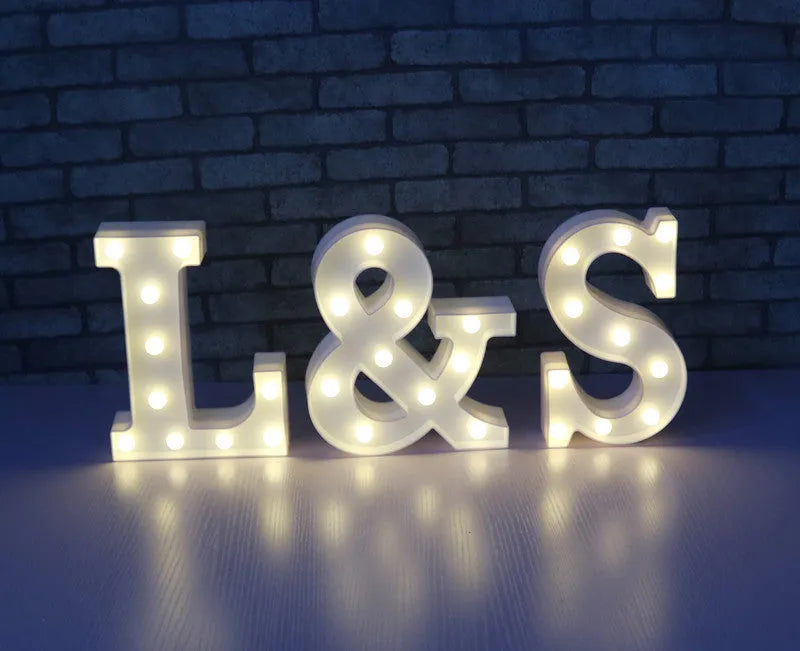 White plastic LED marquee letter sign with warm white glow, 22cm tall