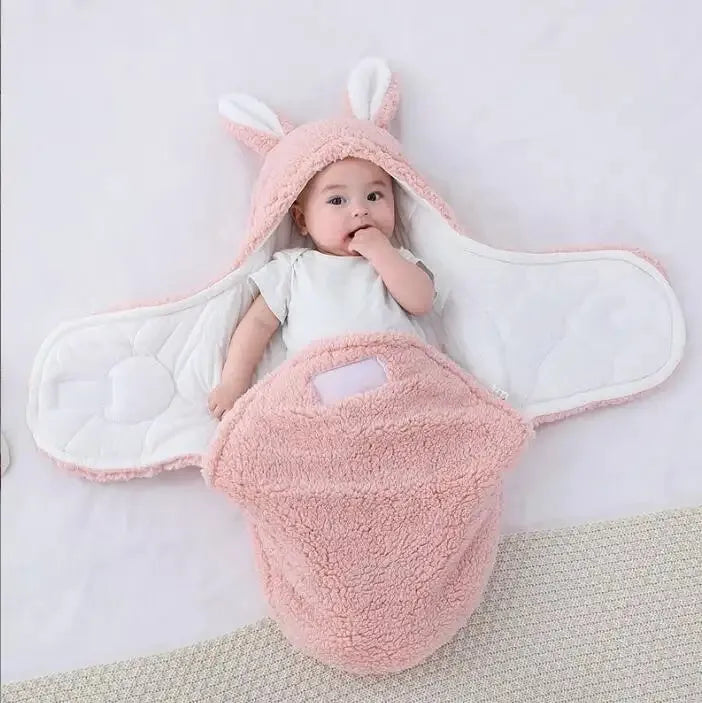 Baby wearing soft fleece sleeping bag with head support and velcro closures