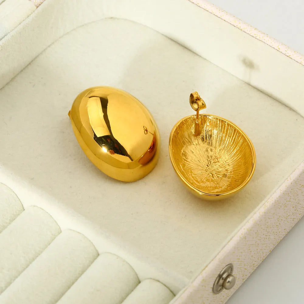 Geometric line earrings in stainless steel with 18K gold electroplated finish and glazed surface