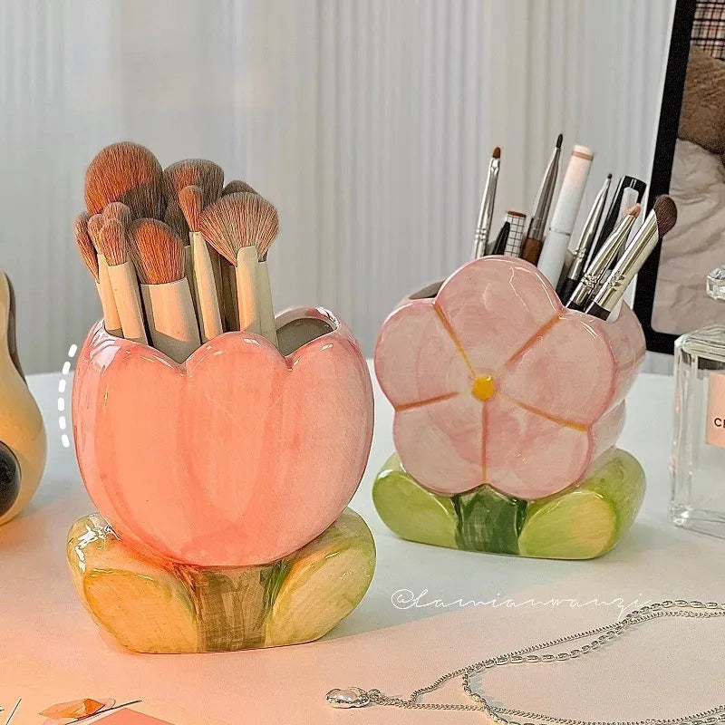 Ceramic pen holder storage box with floral pattern decoration on desktop