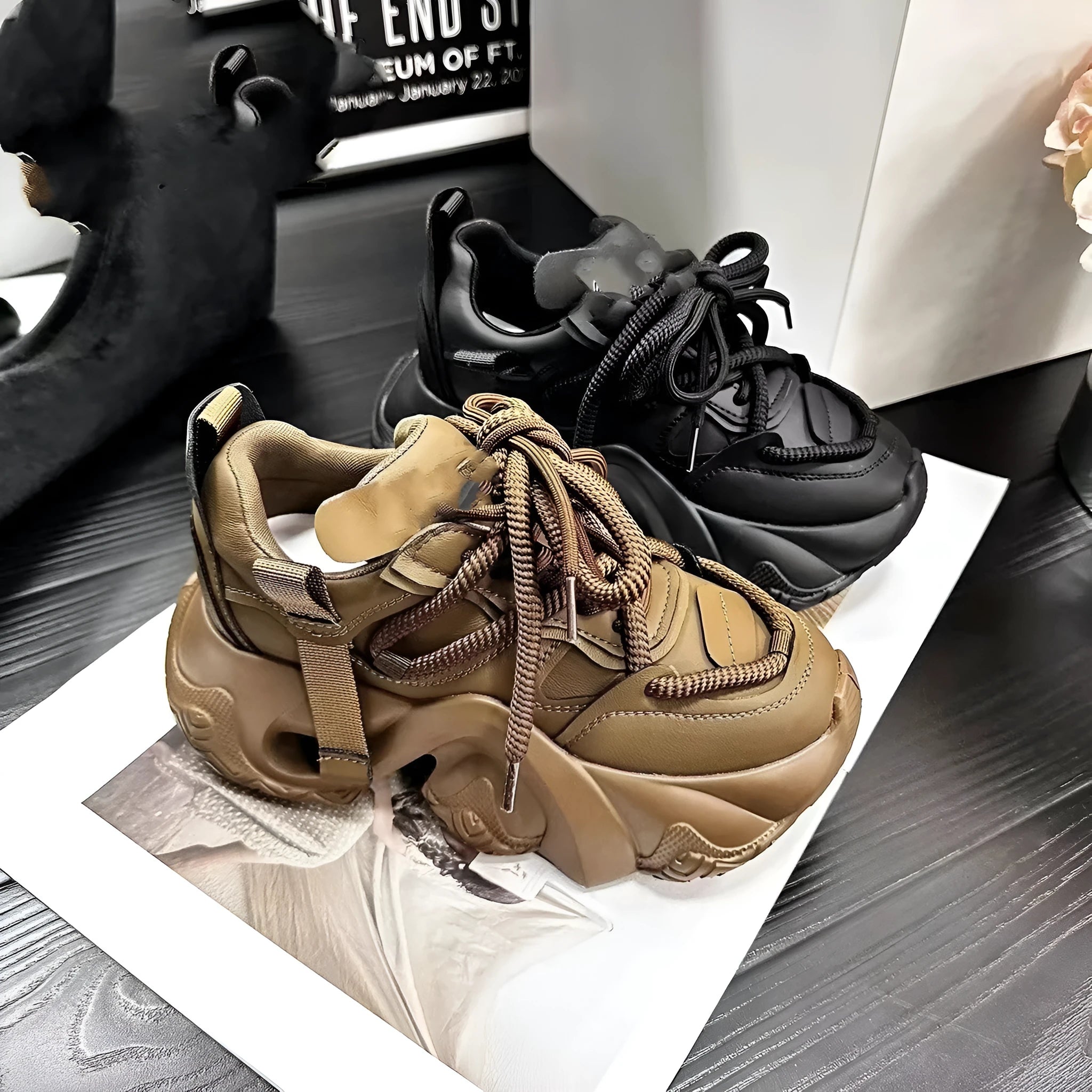 Women's creamy white wedge sneakers with cross straps and a lace-up front on a waterproof platform sole.