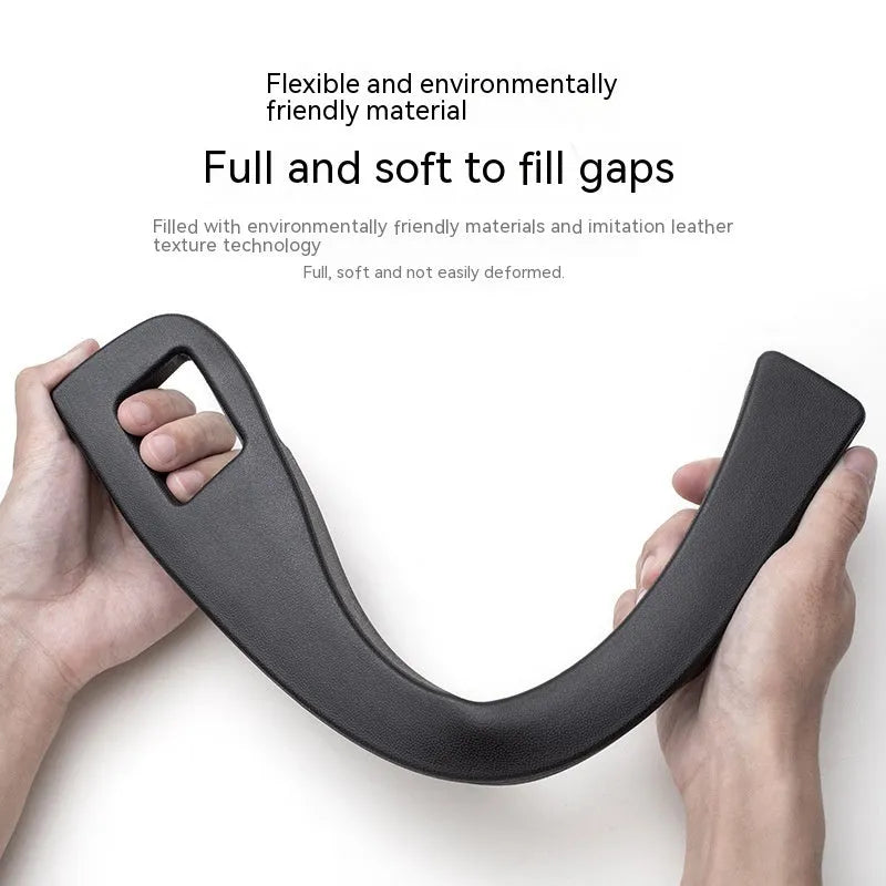 Black plastic car seat gap storage box organising items between vehicle seats
