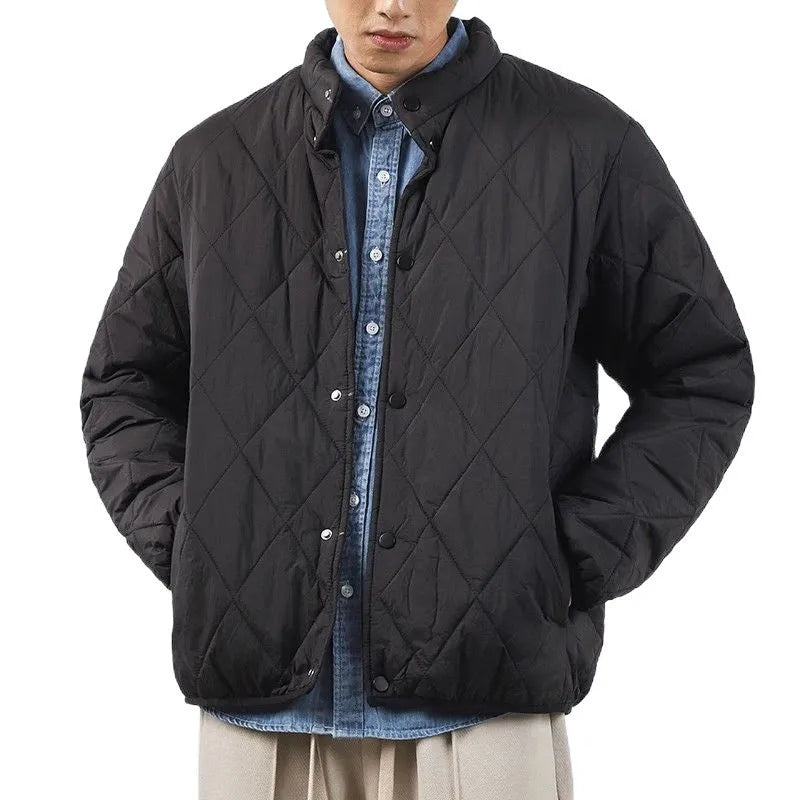 Men's black diamond lattice quilted cotton-padded jacket with extended length and loose fit.