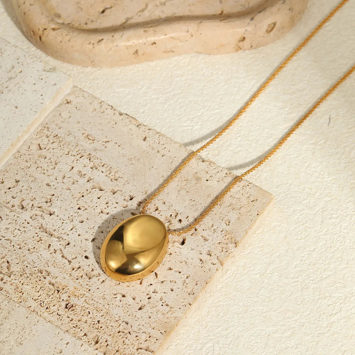 Gold geometric pendant necklace on adjustable 41-50cm chain with stainless steel construction