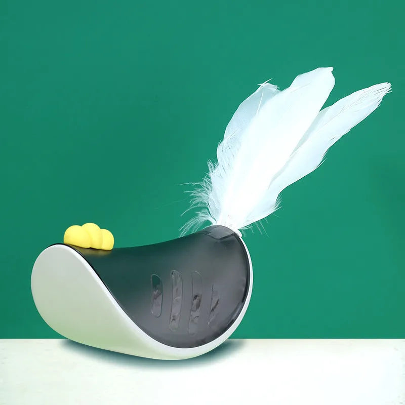 Cat toy tumbler in grey with feather accents on a light background, showcasing playful rolling design