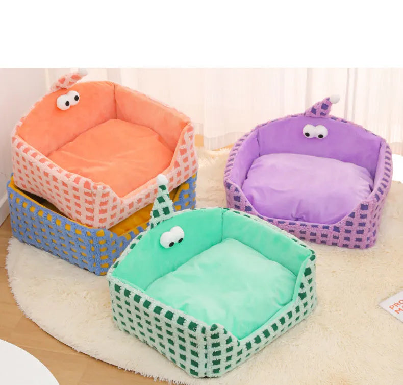 Green triangular pet sleeping nest with removable cover for cats and small dogs.