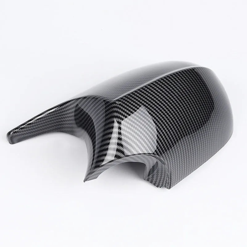 Pair of black ABS plastic rearview mirror shells for BMW 3 Series E90 car.