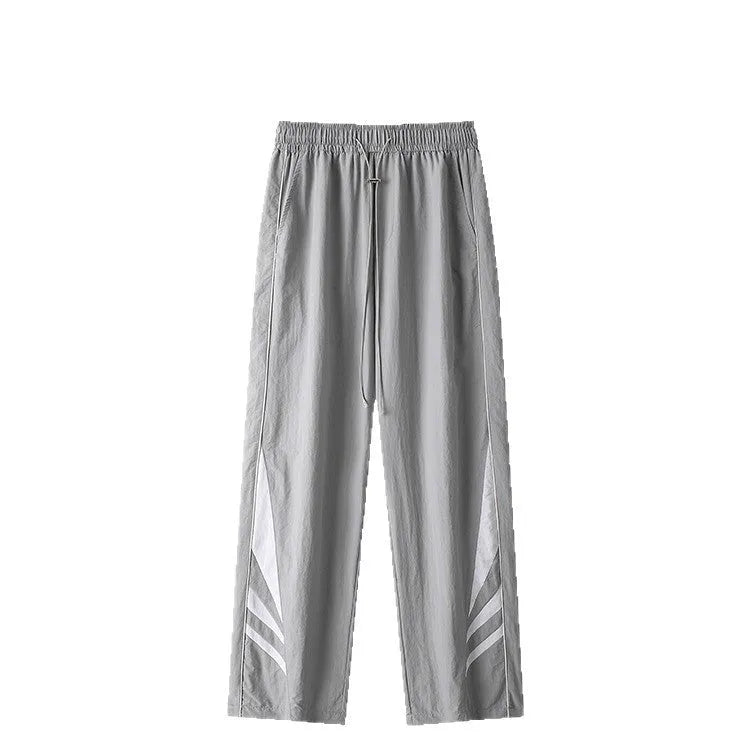 Men's straight-leg grey cotton blend sports trousers with an elasticated waistband laid flat.