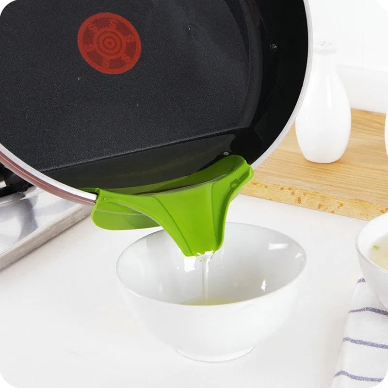 Green silicone kitchen funnel with curved design for clamping onto circular pot rims.