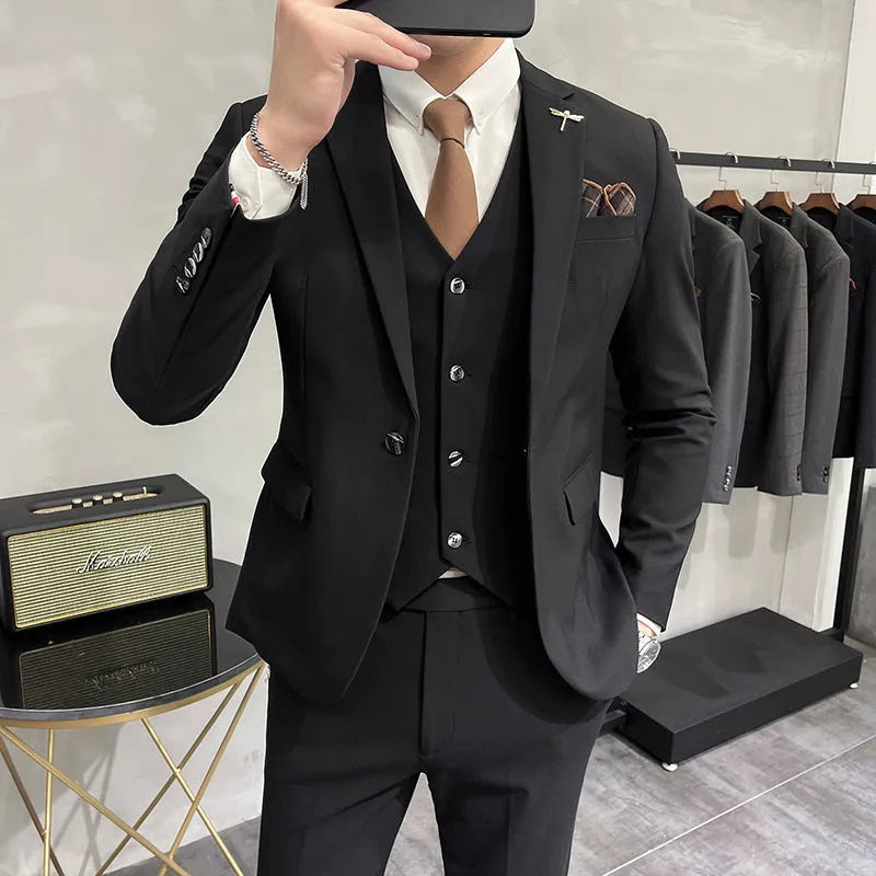 Three-piece men's acetate fibre blend business suit set in light gray with jacket, trousers, and vest.