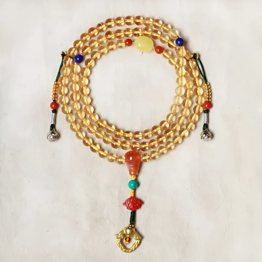 Close-up of a yellow Brazilian citrine bracelet with small 1mm beads on a black filament cord.