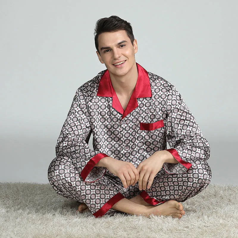 Men's red and blue printed imitation silk pajama suit with lapel collar, long sleeves, and trousers on a model
