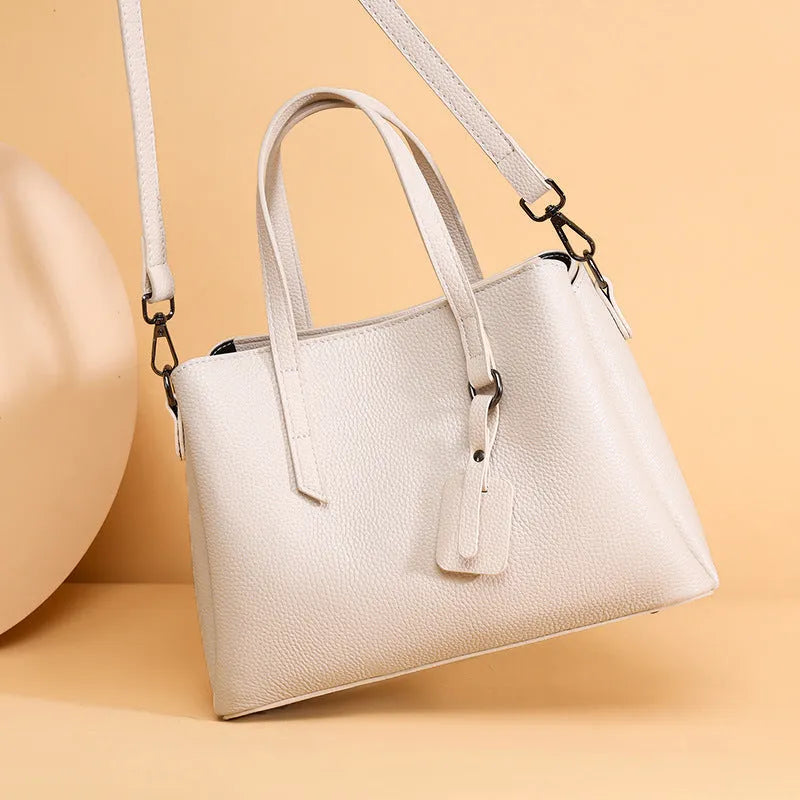Women's genuine cowhide leather handbag in horizontal square shape with single shoulder strap