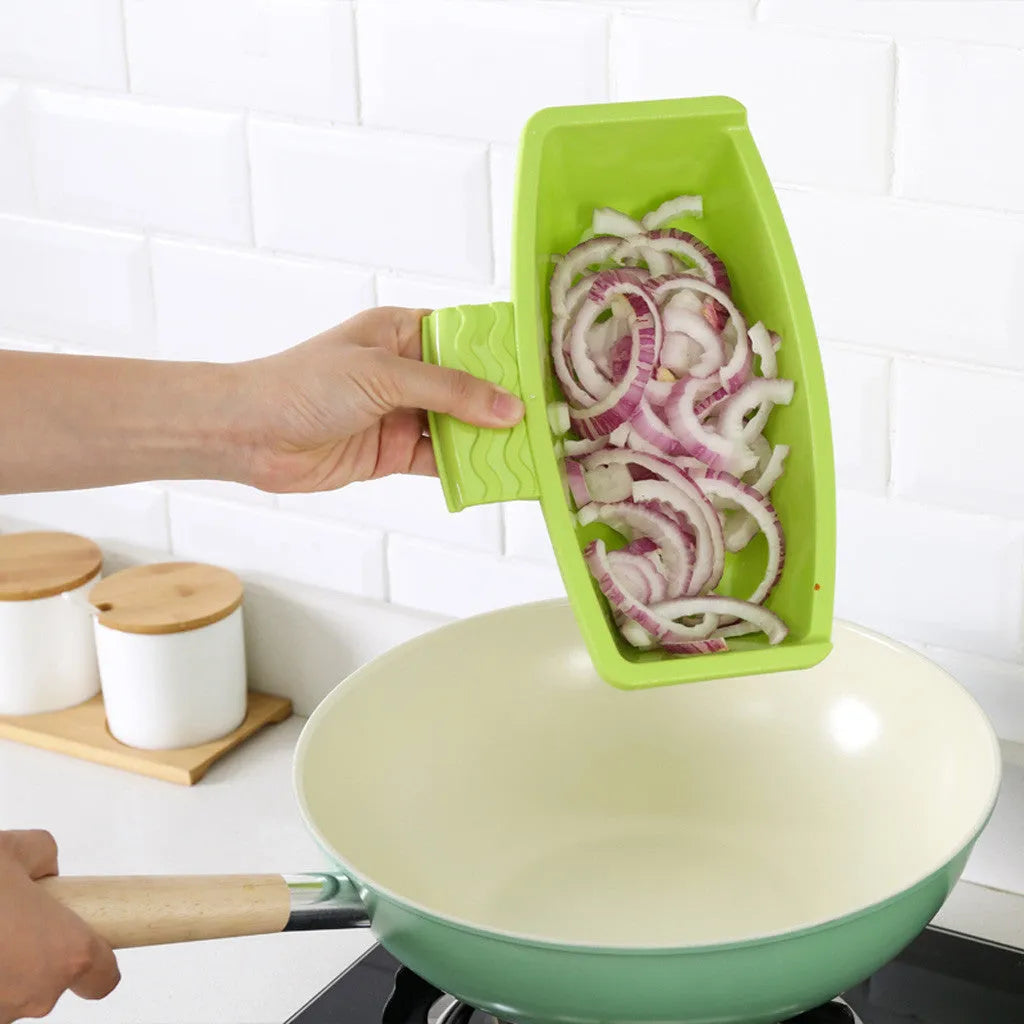 Green multi-function cutting board with drain holes mounted on a kitchen sink edge