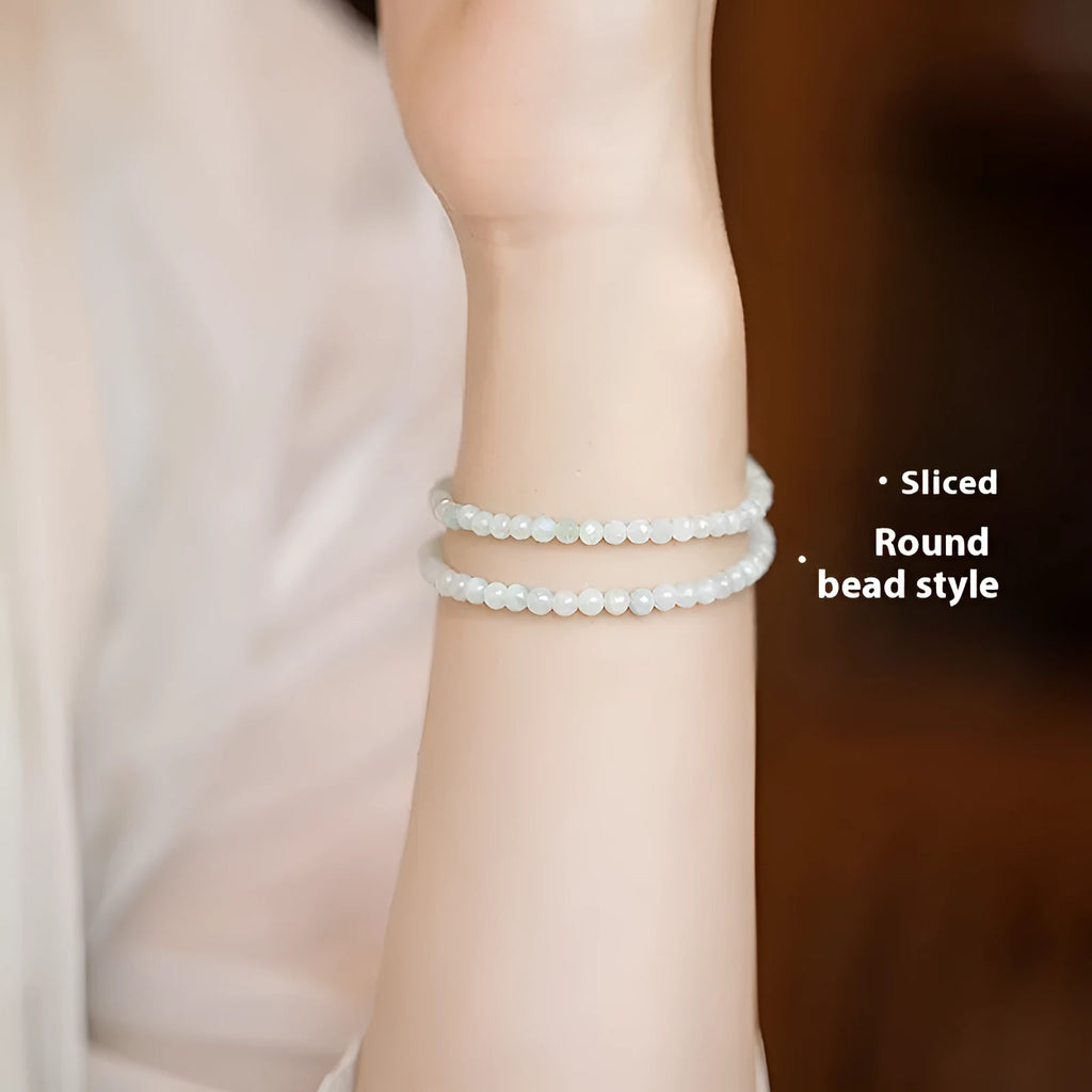 Women's Korean style retro jade ball bracelet on a wrist, showing the bead detail and chain clasp.