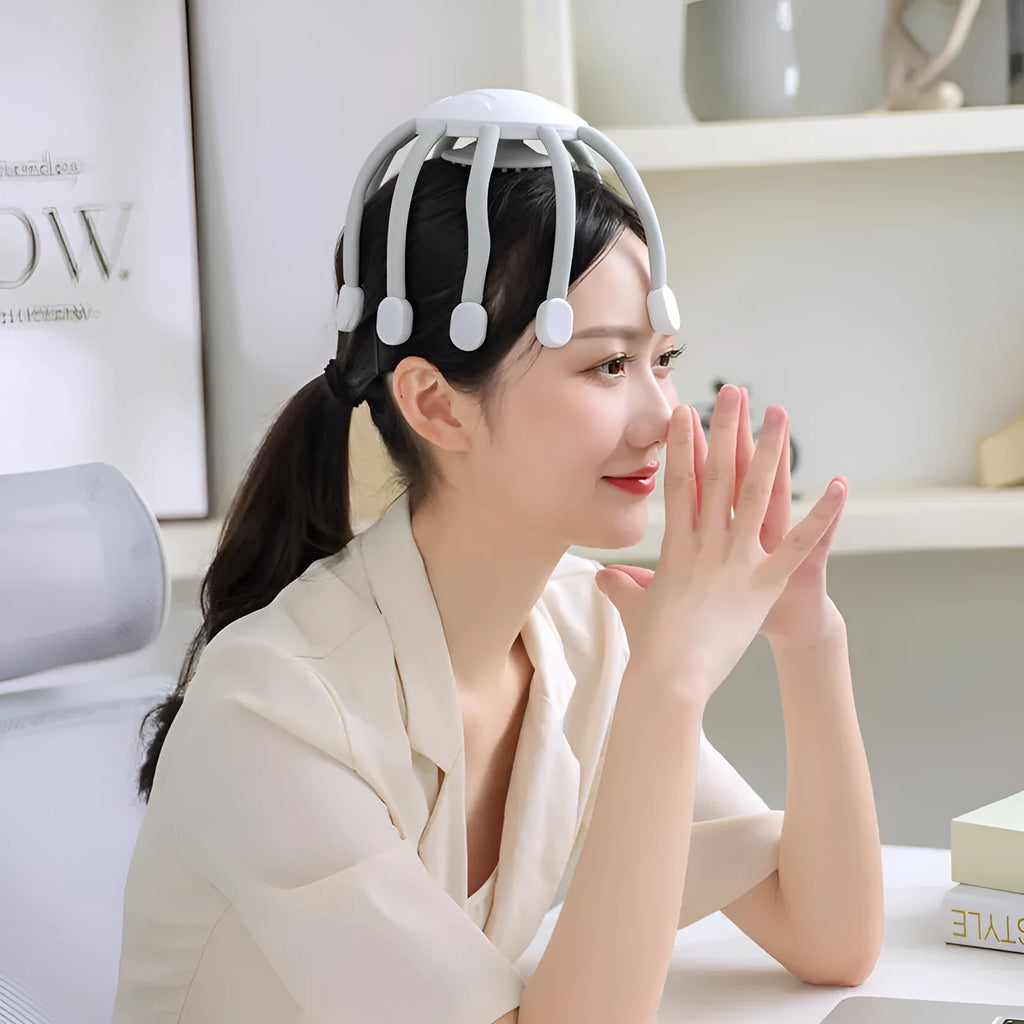Black USB rechargeable head massager with multiple vibrating claws on a white background.