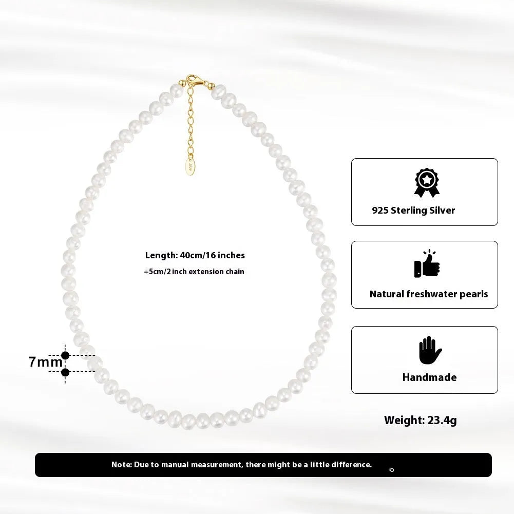 Women's adjustable necklace with natural freshwater pearls on a sterling silver chain.
