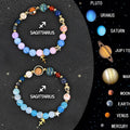 Two natural stone beaded bracelets with Chinese zodiac animal designs on a dark surface.