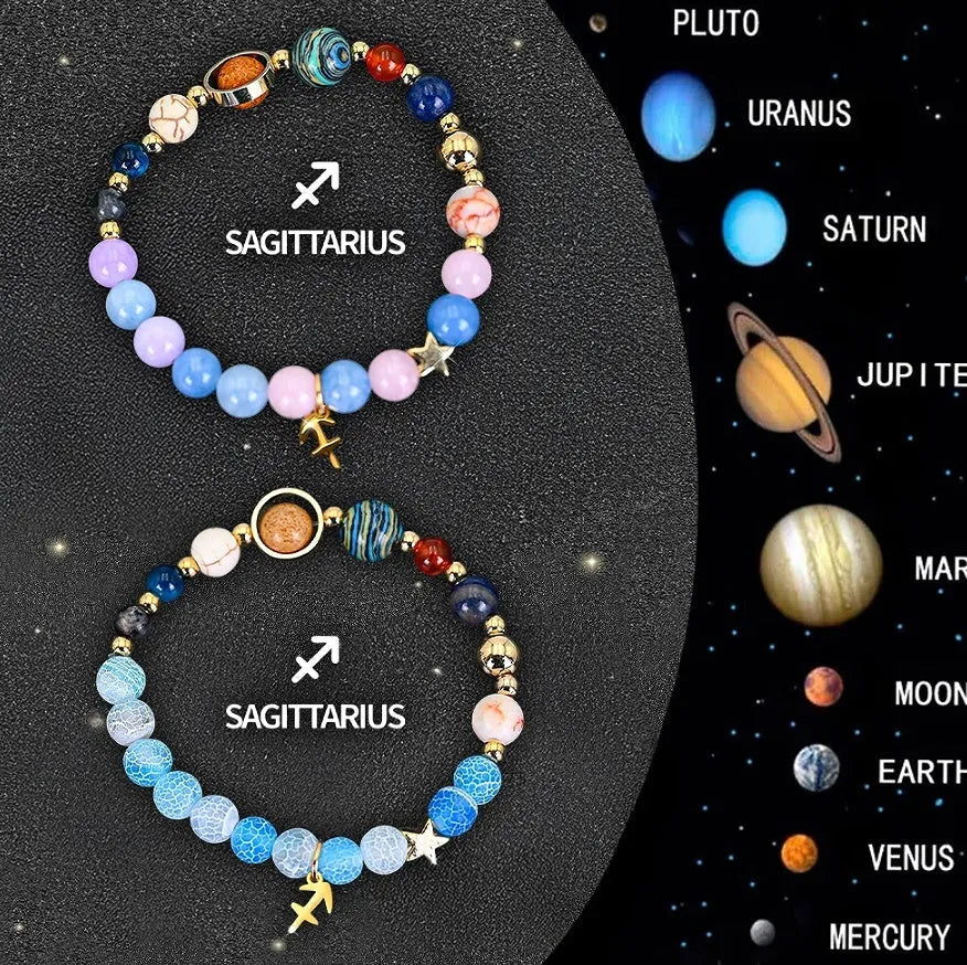 Two natural stone beaded bracelets with Chinese zodiac animal designs on a dark surface.
