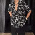 Loose-fitting white women's short sleeve shirt with a floral print pattern.