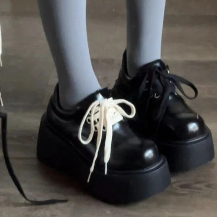 Matte black women's lace-up shoes with a chunky 6-8cm heel and round toe on a white background.