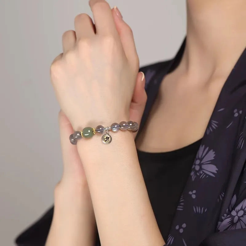 Birth Buddha Beads moonstone bracelet with 8mm beads featuring Thousand-Hand Kwan-yin mouse design