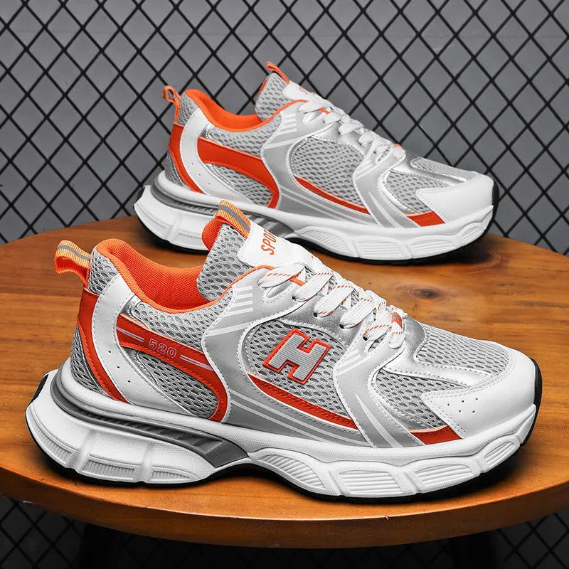 Men's mesh running shoes in black, white orange, and white and grey colours with plastic soles