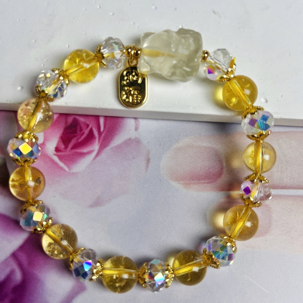 Handmade citrine crystal bracelet with a detailed nine-tail fox charm on a gold-toned chain.