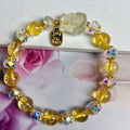 Handmade citrine crystal bracelet with a detailed nine-tail fox charm on a gold-toned chain.