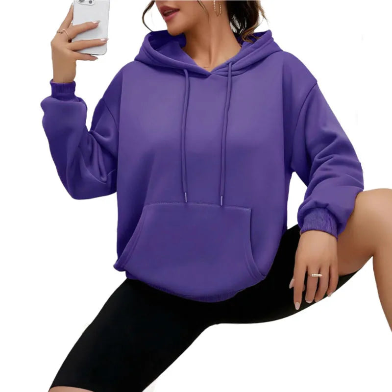 Loose fit women's drawstring hoodie in a choice of multiple colours on a hanger.
